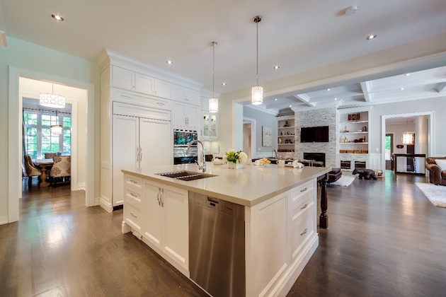 The pedestal leg detail featured in the storybook kitchen carry into other Lionsgate Design spaces, including a detailed turned-wood leg supporting the Caesarstone island countertop. The pedestal leg detail featured in the storybook kitchen carry into other Lionsgate Design spaces, including a detailed turned-wood leg supporting the Caesarstone island countertop.